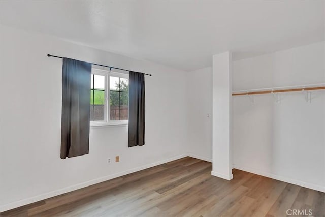 spare room with hardwood / wood-style flooring