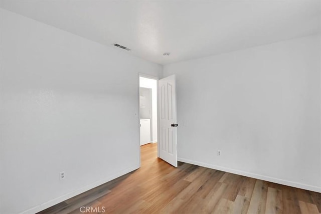 spare room with light wood-type flooring