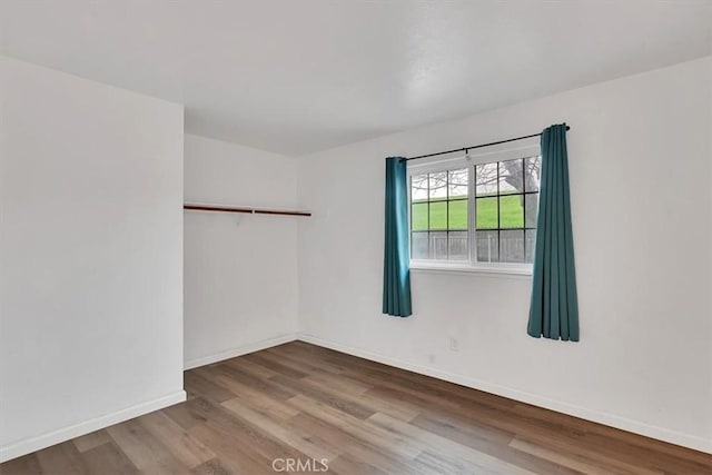 empty room featuring wood-type flooring