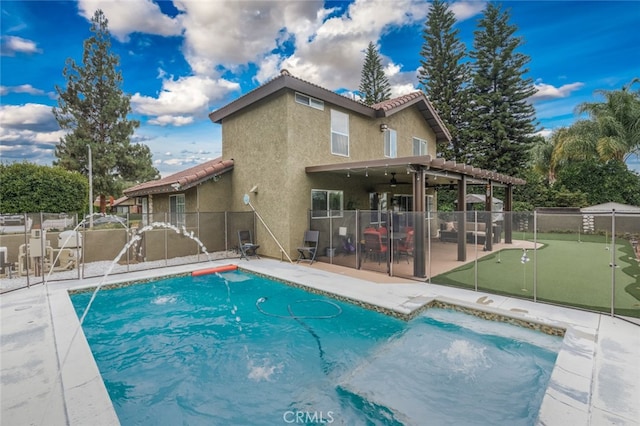 view of pool with pool water feature, a patio area, and a pergola