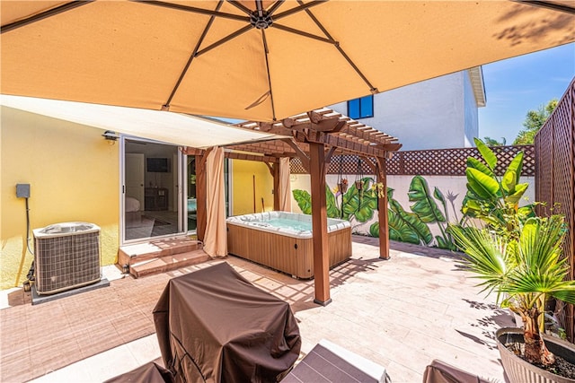 view of patio with a hot tub, a pergola, and central AC unit