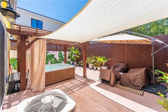 view of patio featuring a hot tub and central air condition unit