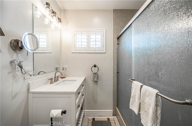 bathroom featuring walk in shower, vanity, and hardwood / wood-style floors