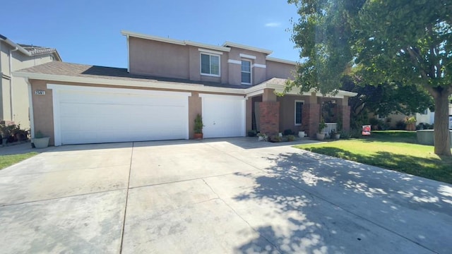 front facade featuring a garage and a front lawn