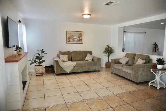 living room featuring light tile patterned flooring