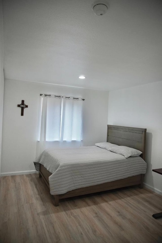 bedroom featuring hardwood / wood-style flooring