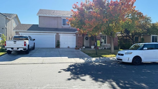 obstructed view of property with a garage