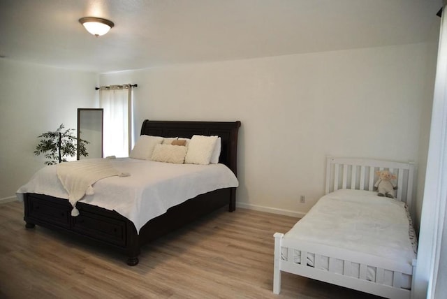 bedroom featuring hardwood / wood-style floors