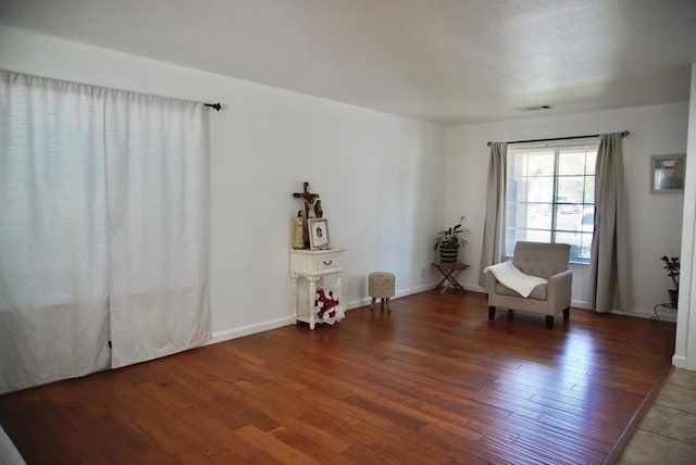 living area with dark hardwood / wood-style flooring