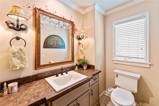 bathroom featuring vanity, crown molding, toilet, and tile patterned flooring