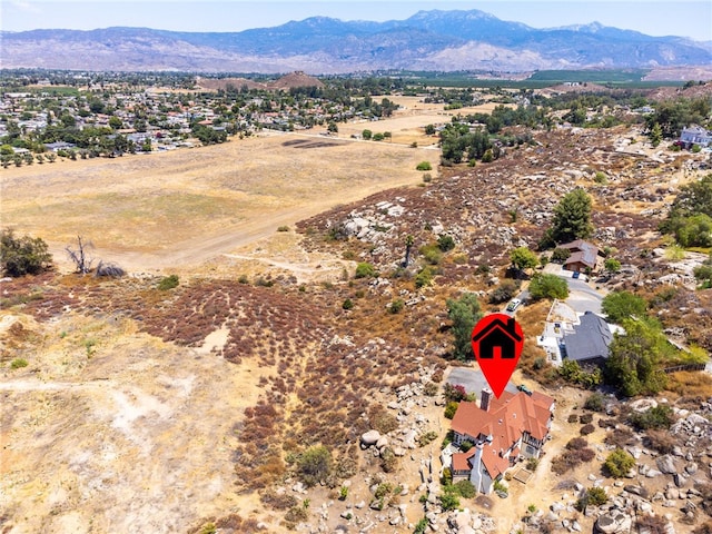 birds eye view of property featuring a mountain view