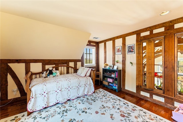 bedroom featuring dark hardwood / wood-style flooring