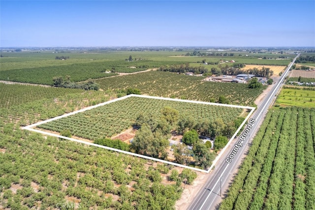 birds eye view of property featuring a rural view