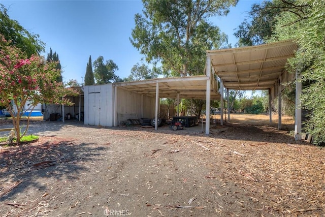 view of parking featuring a carport