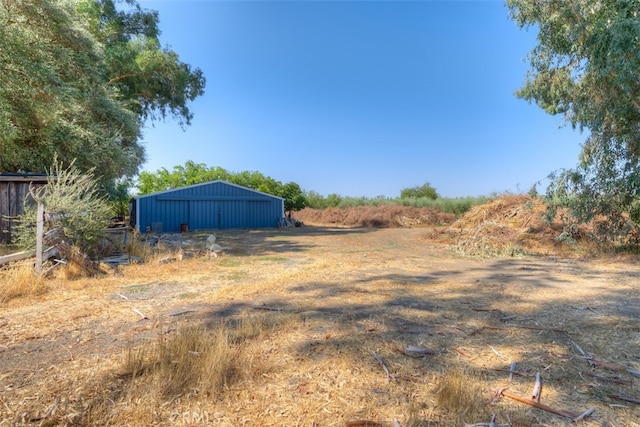 view of yard with a rural view