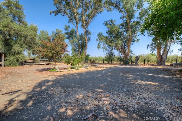 view of yard with a rural view