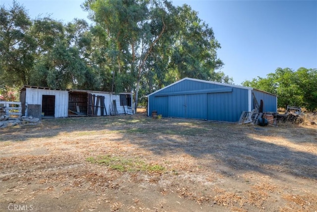 4065 County Rd S, Orland, CA 95963 - view of yard with a pole building, an outbuilding, and view of scattered trees