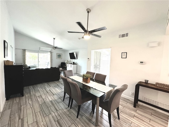 dining room with ceiling fan, a wall mounted AC, lofted ceiling, and light hardwood / wood-style floors