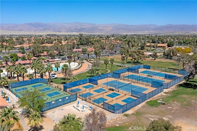 birds eye view of property with a mountain view