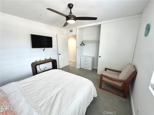 carpeted bedroom with a closet and ceiling fan