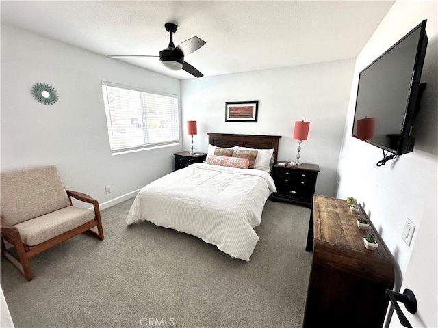 bedroom featuring ceiling fan and carpet