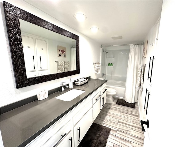 full bathroom featuring vanity, toilet, and shower / tub combo