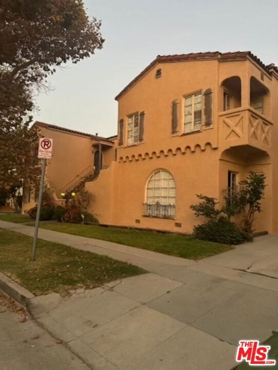 view of property exterior featuring a balcony