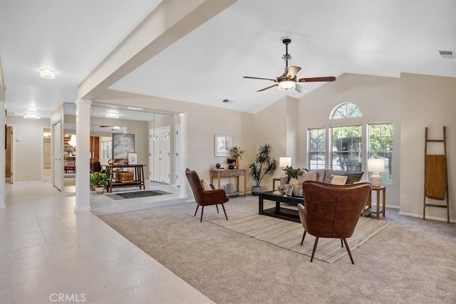 living room with high vaulted ceiling, visible vents, ornate columns, a ceiling fan, and light carpet