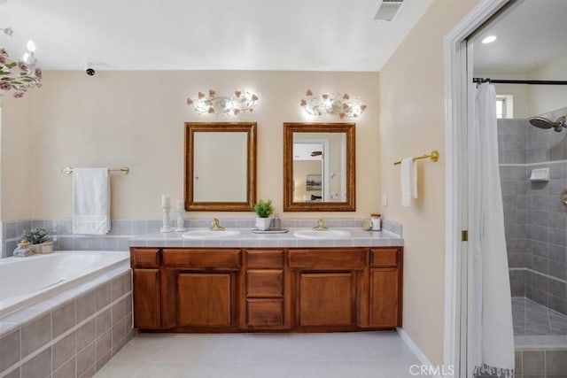 full bathroom with double vanity, tiled shower, a sink, and a garden tub