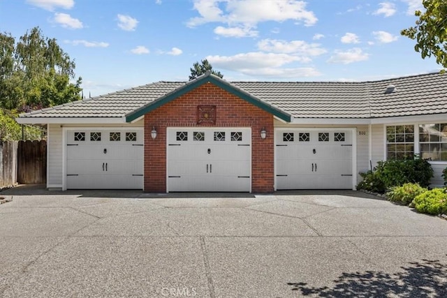 garage with fence