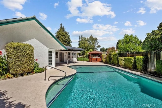 view of swimming pool featuring a fenced backyard, a patio, and a fenced in pool