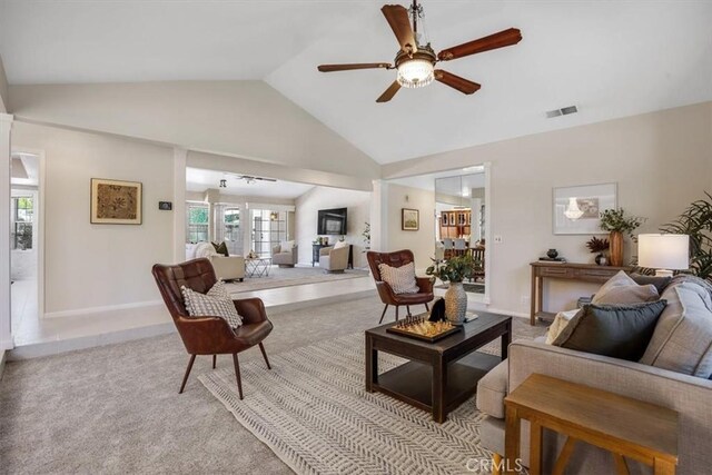 living room with ceiling fan, light colored carpet, lofted ceiling, and french doors