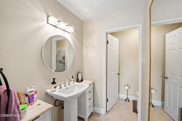 bathroom with tile patterned floors