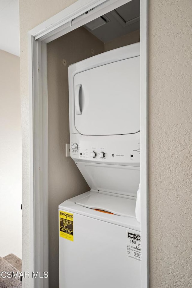 laundry room featuring stacked washer and dryer