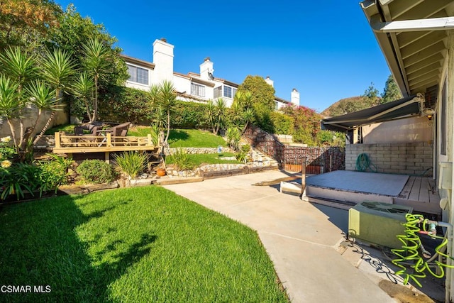 view of yard with a patio area and a deck