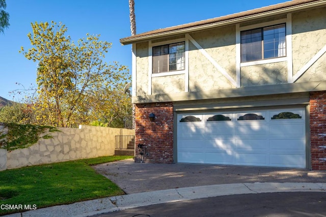 view of side of home featuring a garage