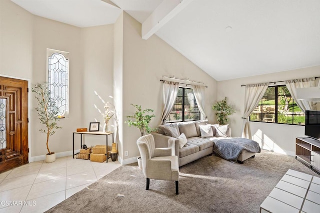 tiled living room with beamed ceiling, plenty of natural light, and high vaulted ceiling