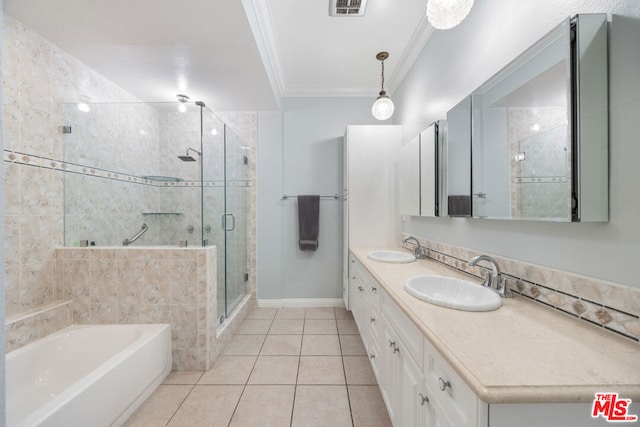 bathroom featuring tile patterned floors, vanity, separate shower and tub, and crown molding