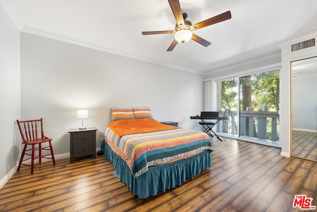 bedroom featuring ceiling fan, dark hardwood / wood-style flooring, and crown molding