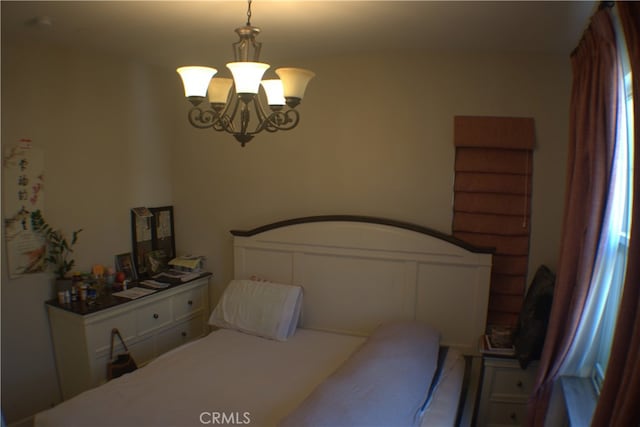 bedroom with an inviting chandelier