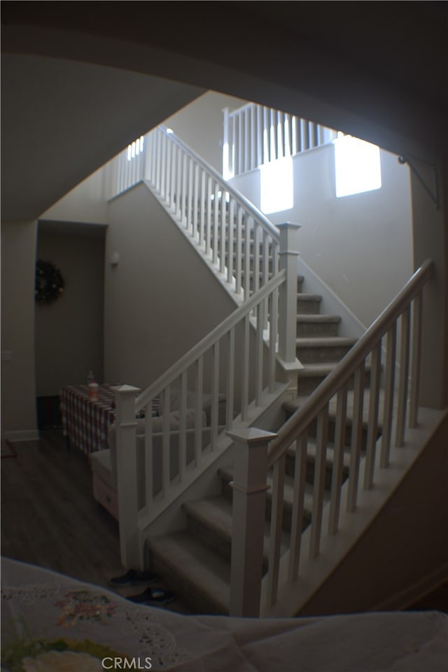 staircase featuring hardwood / wood-style flooring