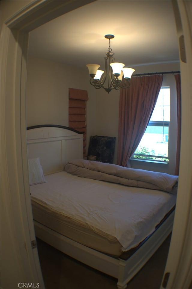 bedroom with a chandelier