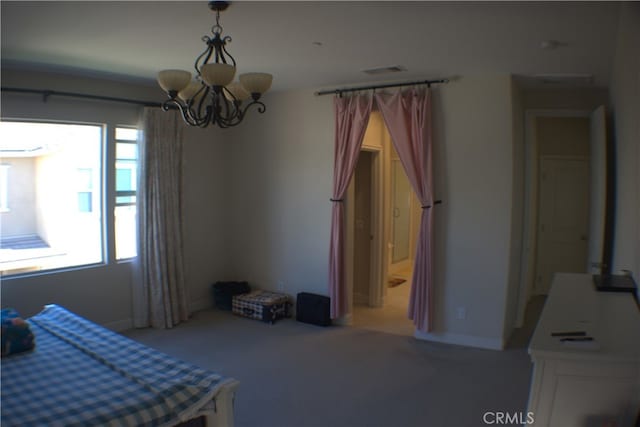 bedroom featuring a notable chandelier and light colored carpet