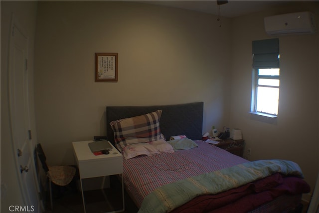 bedroom with a wall unit AC