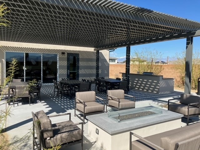 view of patio / terrace featuring a pergola and an outdoor hangout area