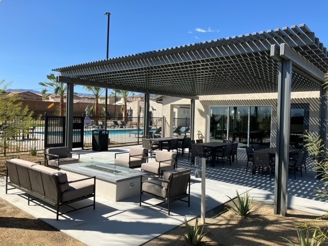 view of patio / terrace featuring outdoor lounge area and a community pool