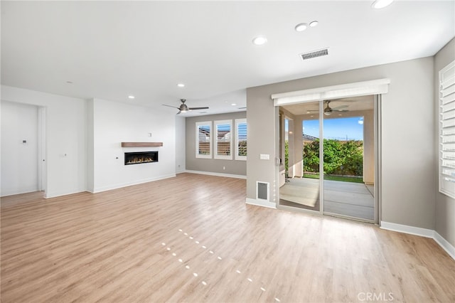 unfurnished living room featuring light hardwood / wood-style floors