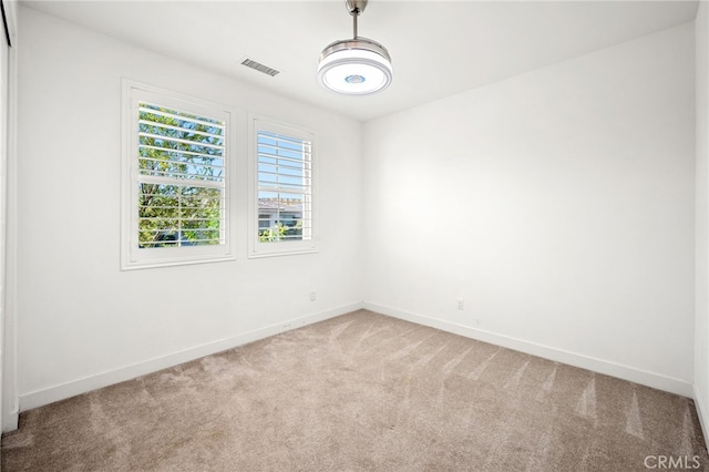 unfurnished room featuring carpet