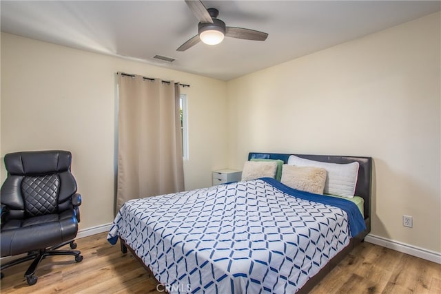 bedroom featuring wood-type flooring and ceiling fan