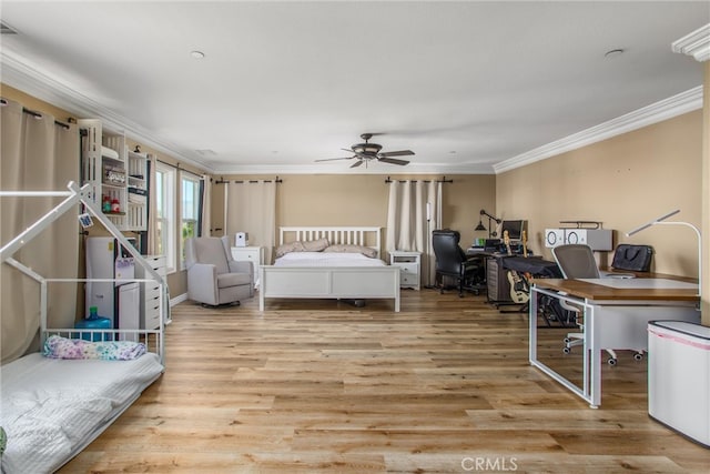 bedroom with light hardwood / wood-style floors, ceiling fan, and crown molding